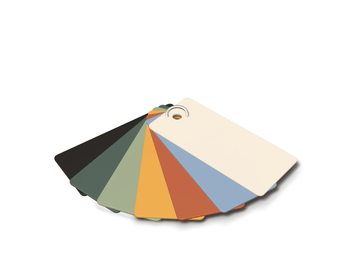 A fan of powder-coat sample tabs in black, green, sage, ochre, oxide red, blue and bone.
