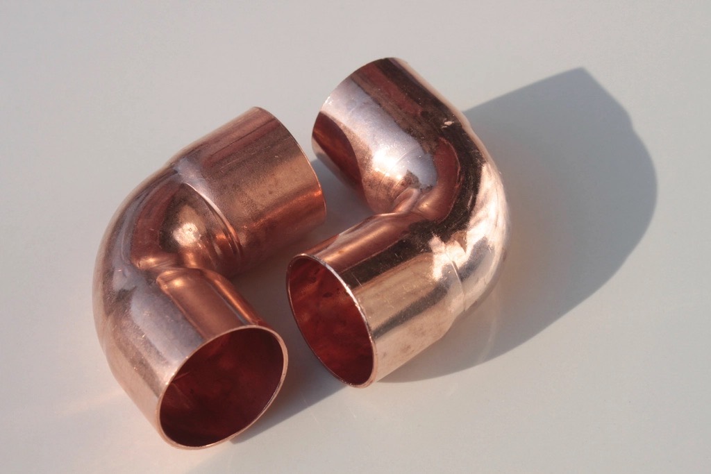 Two new copper elbow fittings